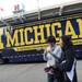 Michigan graduate and current Nebraska PhD student Jia Zhong checks his camera after his friend Meng Zhu took his photo in front of the Michigan equipment trailer at Memorial Stadium in Lincoln, Nebraska on Saturday. Melanie Maxwell I AnnArbor.com